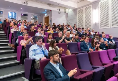 People sat in auditorium.