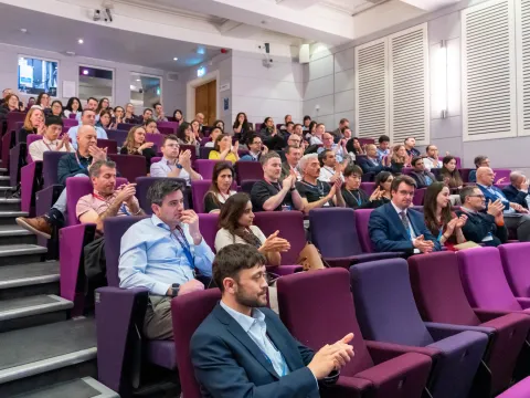 People sat in auditorium.